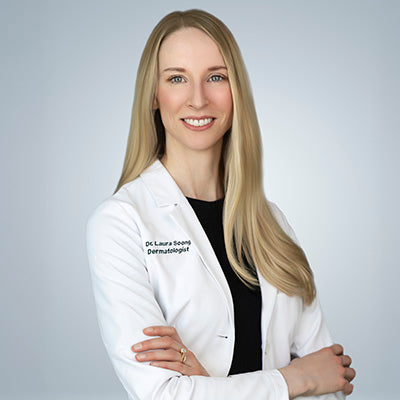 Dr. Laura Soong Dermatologist in white lab coat smiling with arms crossed | Q for Quinn
