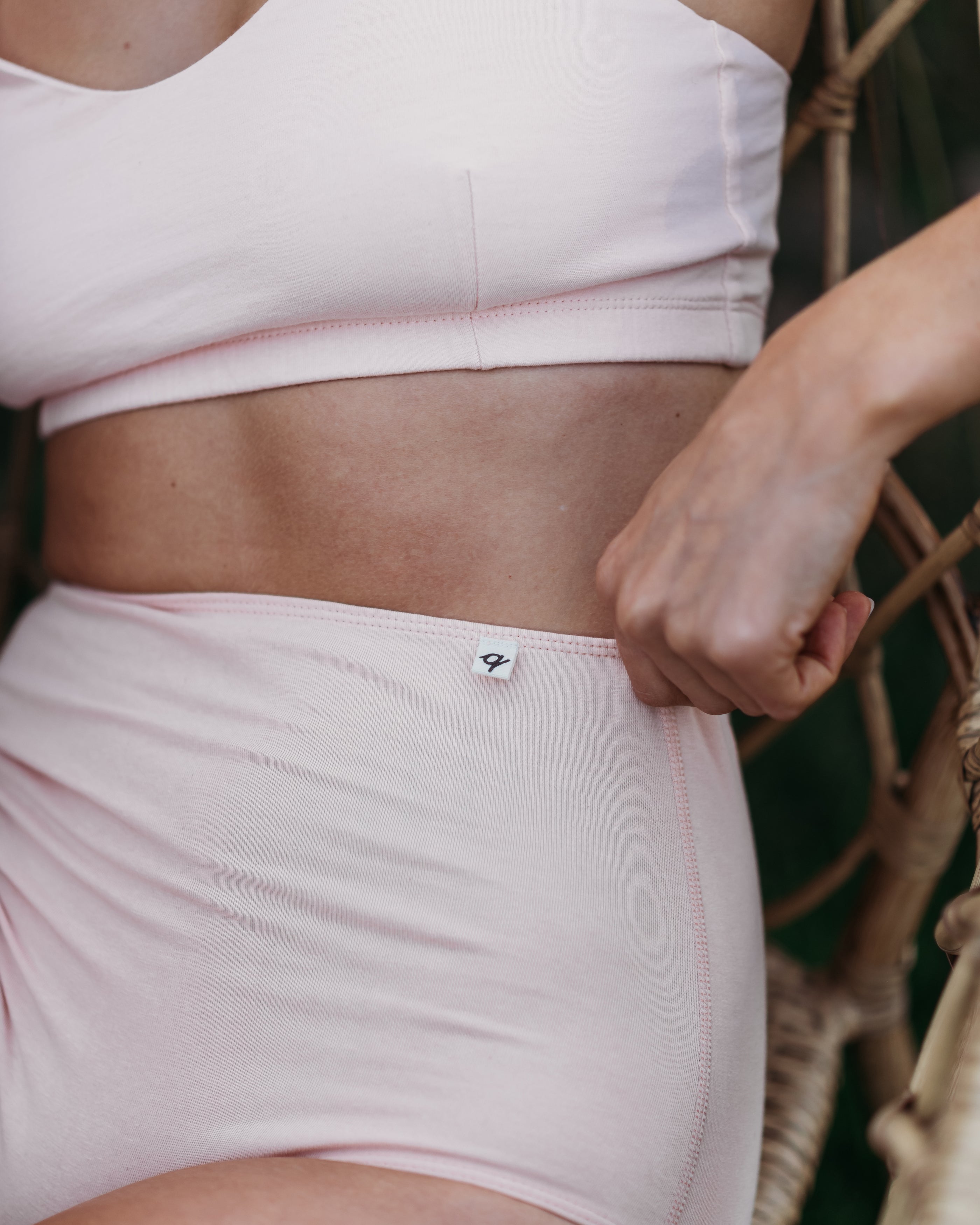 Close-up of Women's High Waist Brief in Light Madder with matching crop top | Q for Quinn