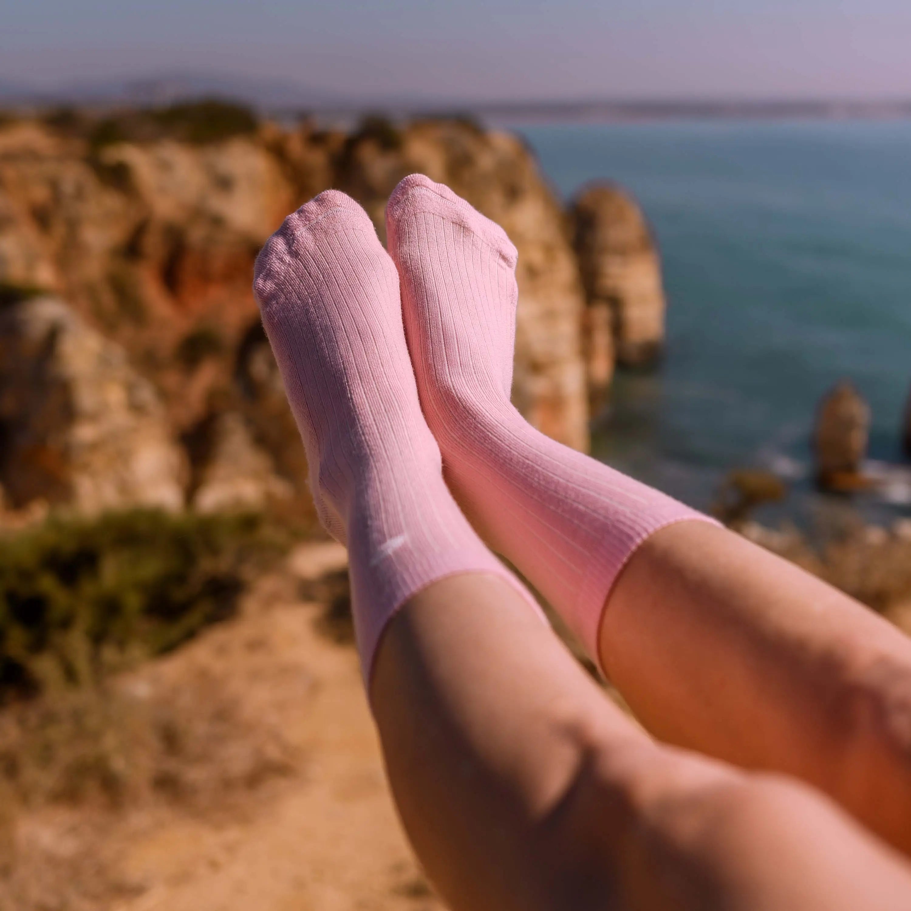Merino Wool - Cotton Midweight Adult Socks Multipack in Pink-and-Blue worn outdoors on rocky coastal cliffside | Q for Quinn