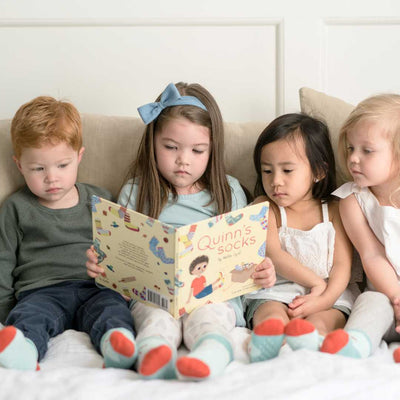kids reading quinns socks book and matching socks