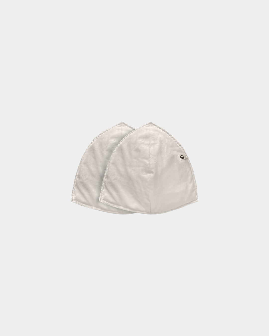 A light beige cotton face mask with a small embroidered logo on the right side, shown against a solid light gray background.