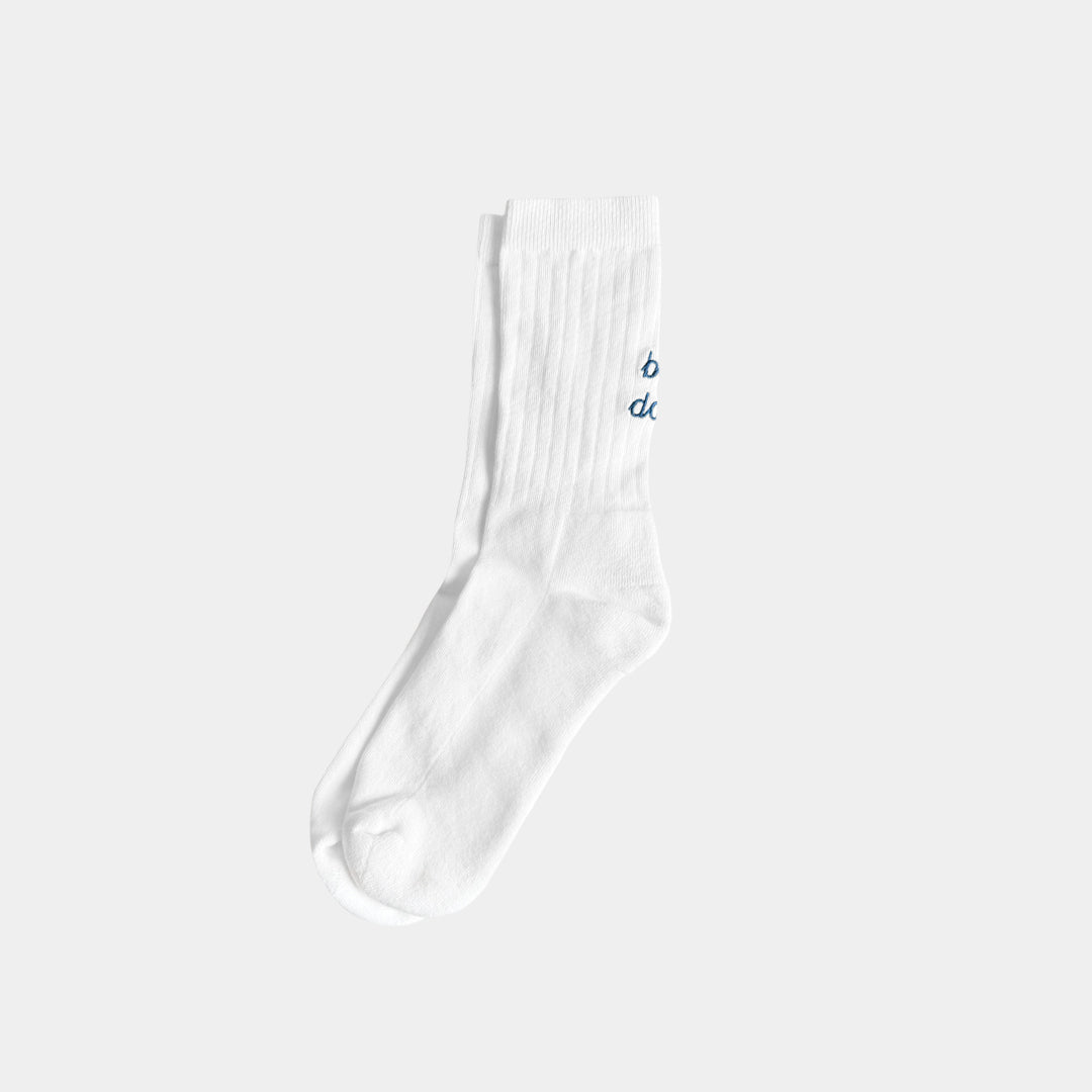 White sock with blue text on a light gray background