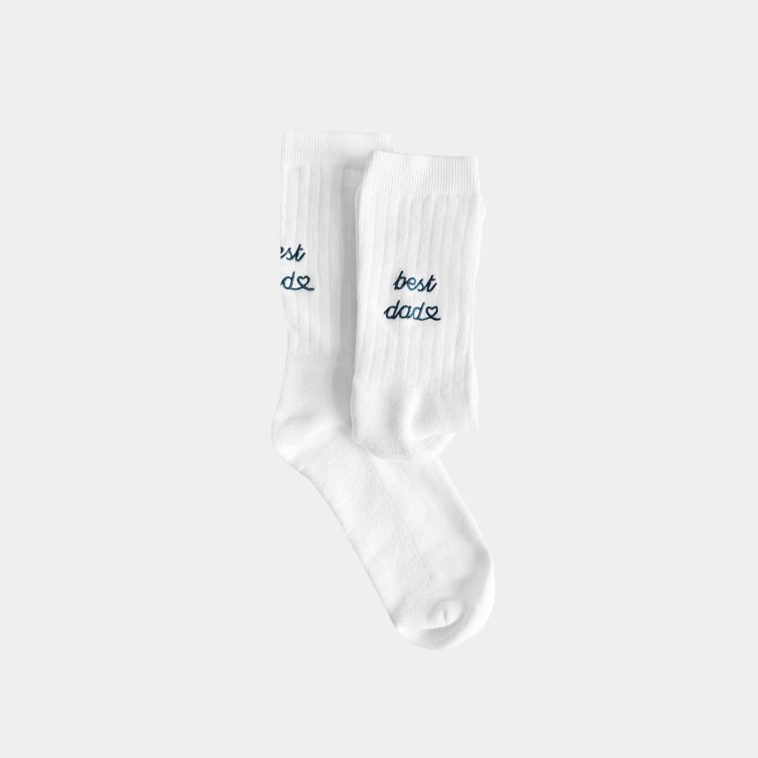 White socks with 'best dad' text on a white background