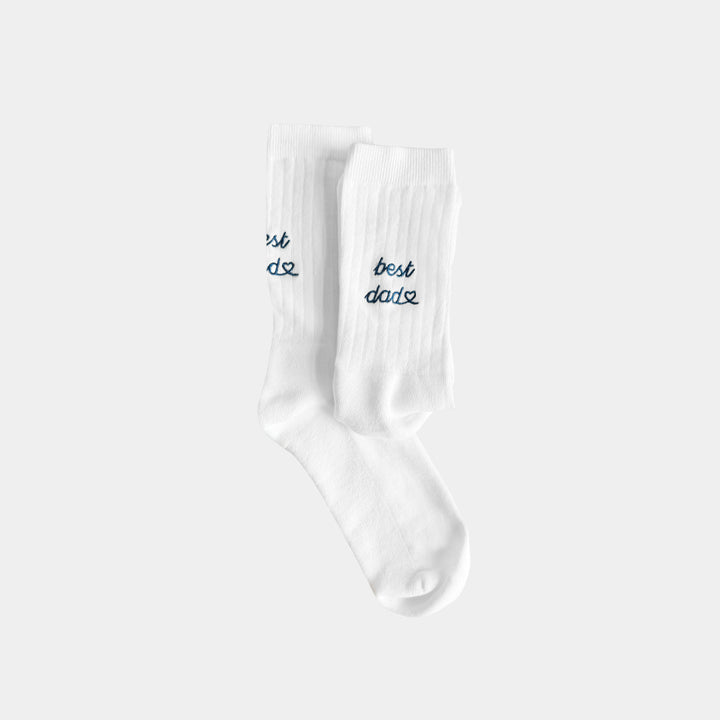 White socks with 'best dad' text on a white background