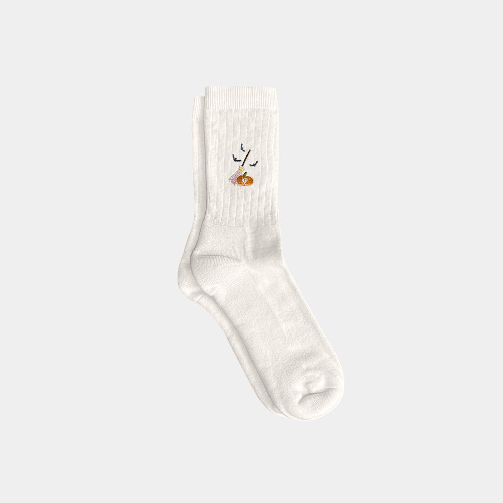 White sock with a small design on a light gray background
