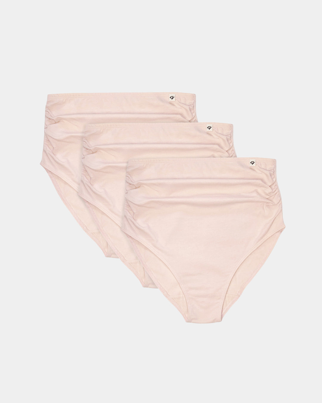 Three pairs of light pink high-waisted underwear on a white background