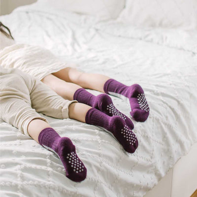 Two Kids Laying Down Wears Merino Wool Socks 