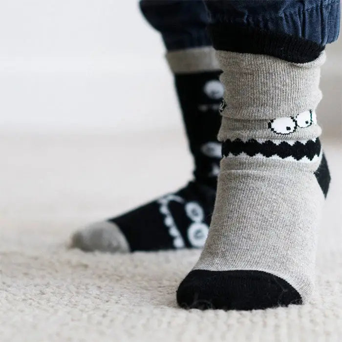 child wearing seamless socks in monochrome monsters design | Q for Quinn