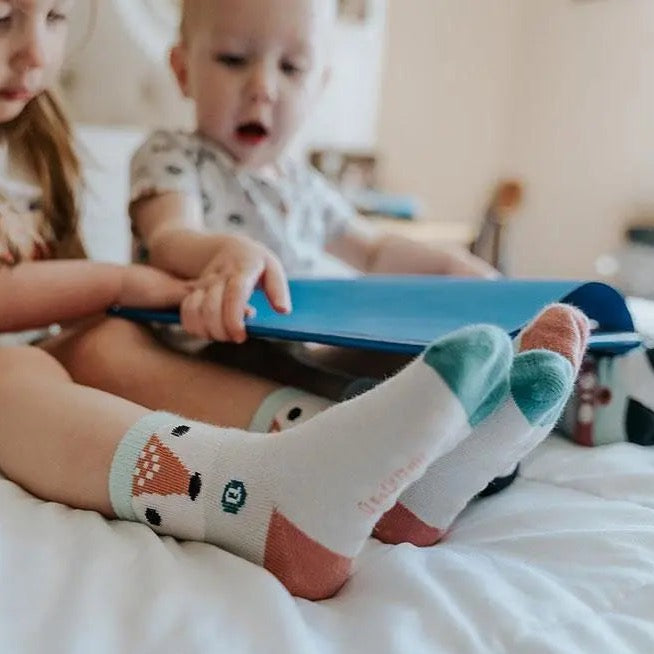 Little girls wearing 'Arctic Animals' socks