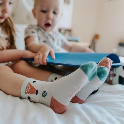 Little girls wearing 'Arctic Animals' socks