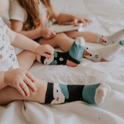 Little girls wearing 'Arctic Animals' socks