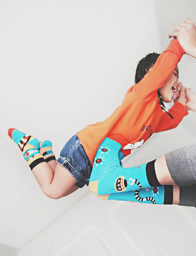 little boy and parent wear inside a robot socks with seamless toe