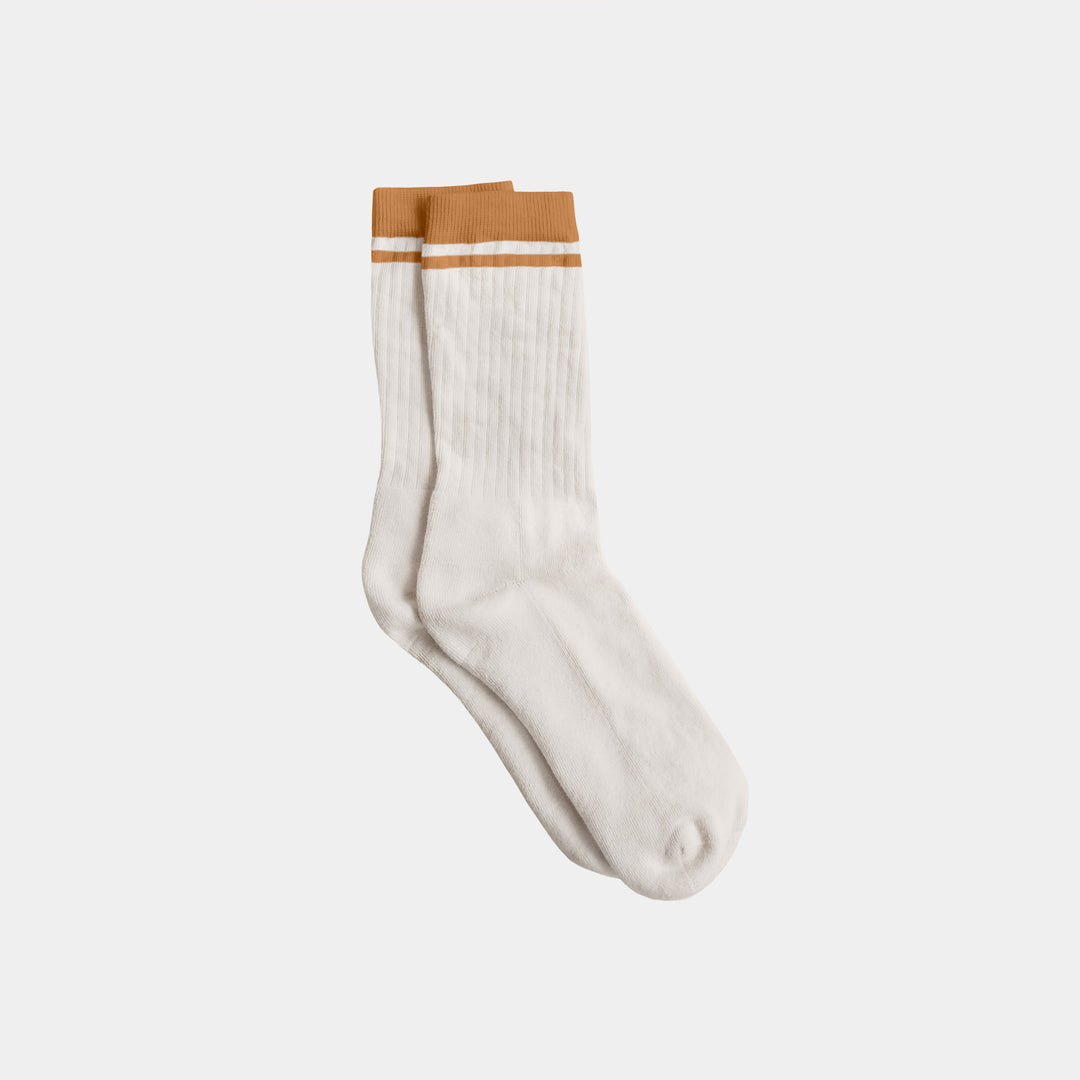 White sock with brown top on a light gray background