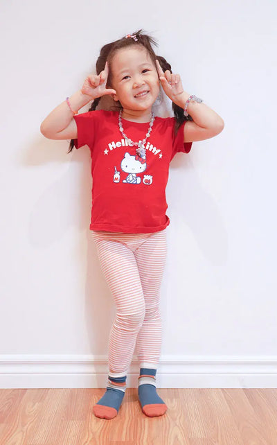 little girl smiling and wearing camo stripes socks | Q for Quinn