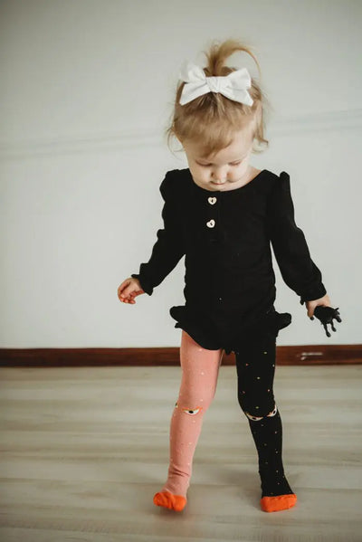 little girl wear organic cotton monster eye tights 