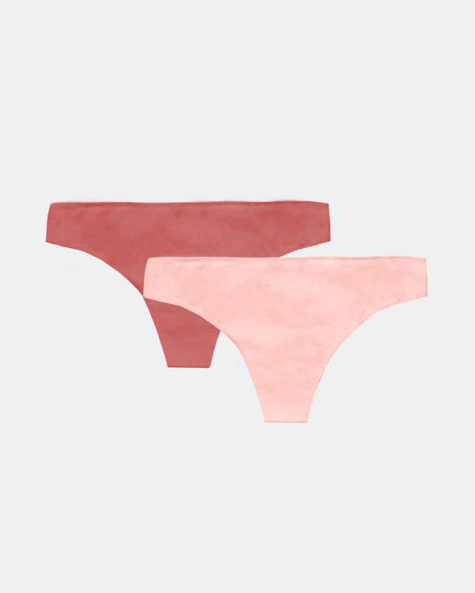 Two pairs of women's underwear, one red and one pink, on a light gray background.