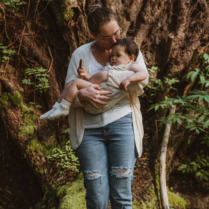 A Lady Carrying Little Girl Wears Pure organic Cotton Socks