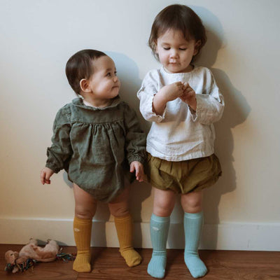Two girls wear ribbed knee high socks 