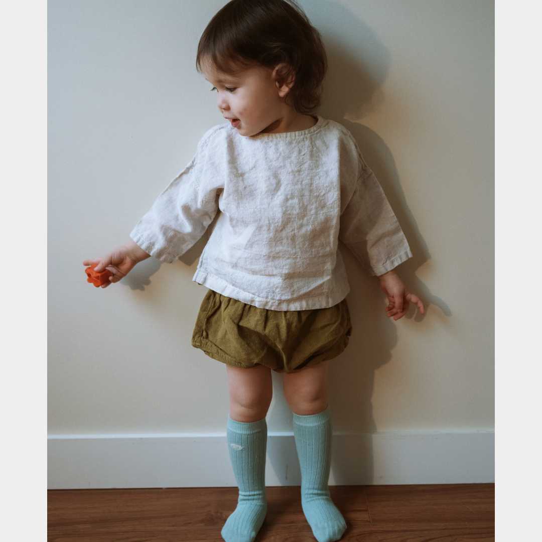 Little girl wears organic cotton socks 