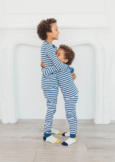 2 boys hugging wearing sailor stripe pyjamas