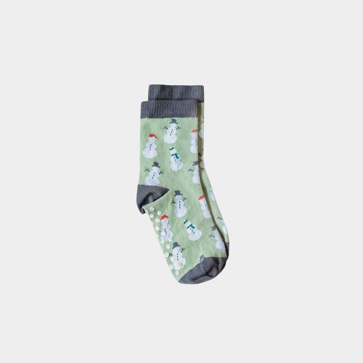 A pair of light green crew socks with a repeating snowman pattern and dark gray ribbed cuffs, heels, and toes, displayed against a light gray background.