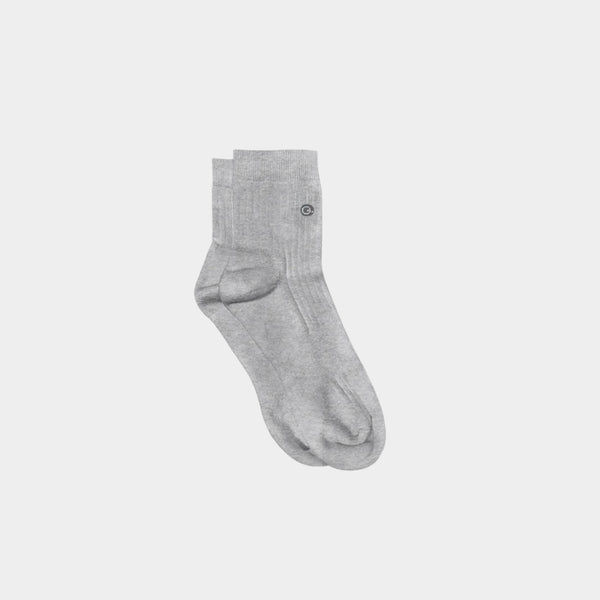 Light grey organic cotton quarter crew kids socks laid flat on white background | Q for Quinn
