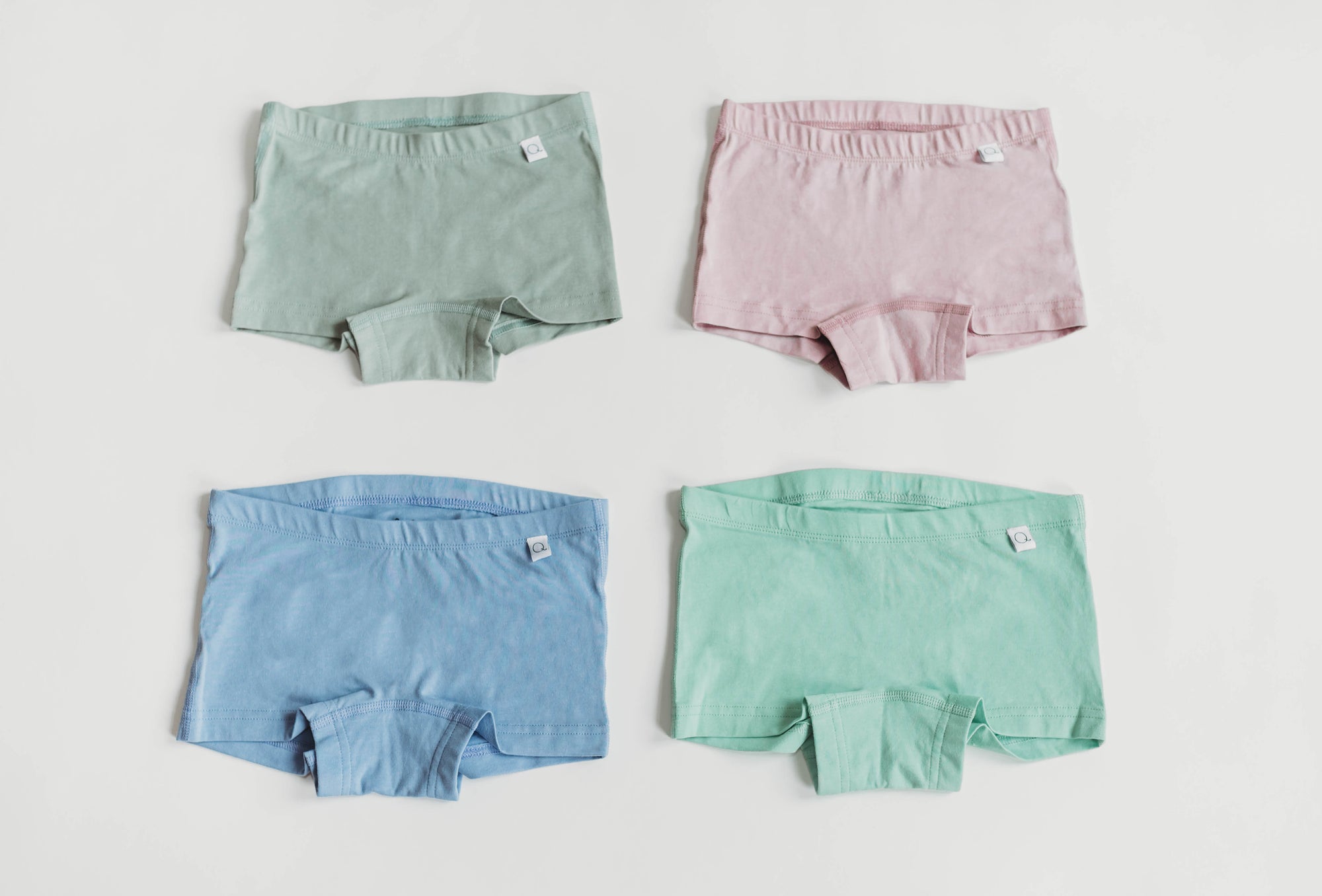 4 organic cotton boyshort underwear in sage, pink, blue & mint laid flat | Q for Quinn