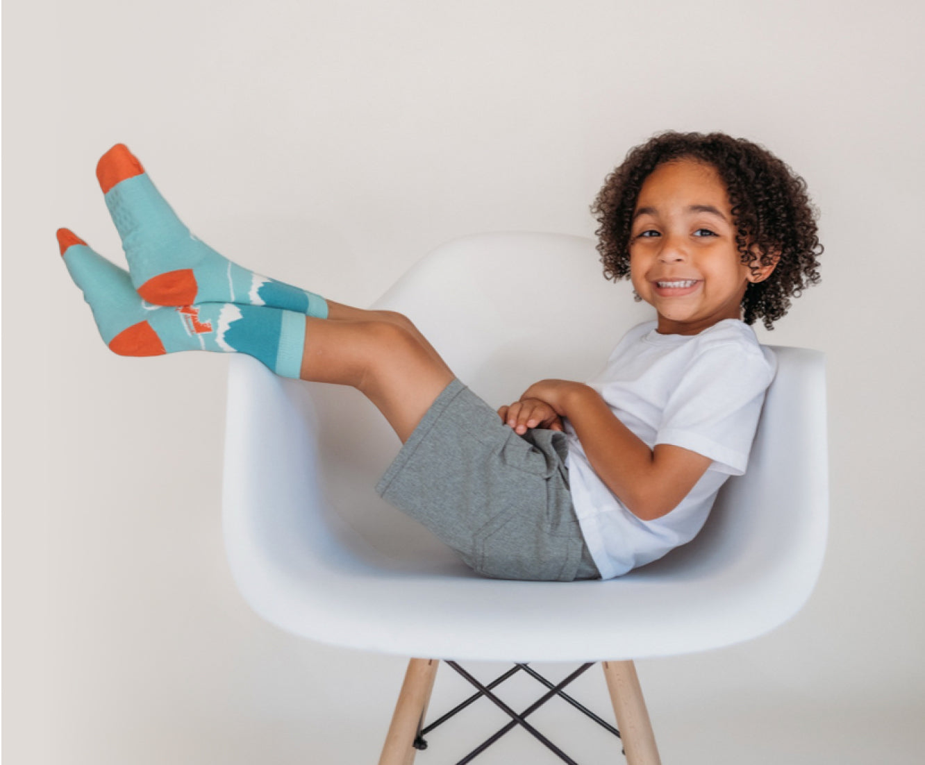 kid wearing Q for Quinn socks